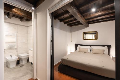 Postel nebo postele na pokoji v ubytování Pantheon by Agrippa Suite