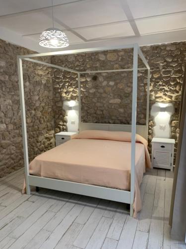 En eller flere senger på et rom på LA CASA DI PIETRA