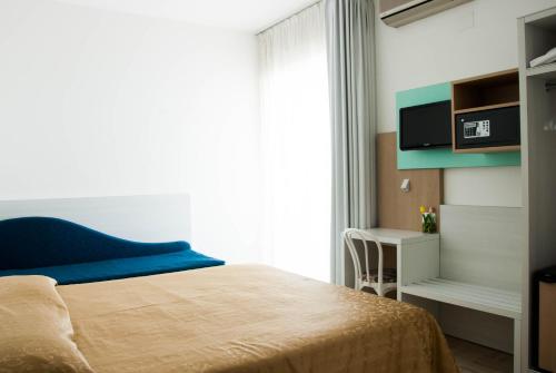Säng eller sängar i ett rum på Hotel Eden