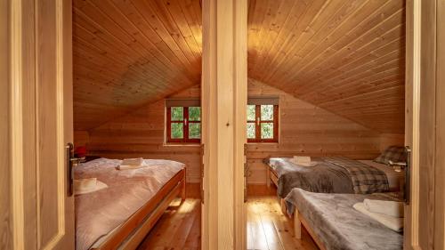 Postelja oz. postelje v sobi nastanitve Wooden House Pia