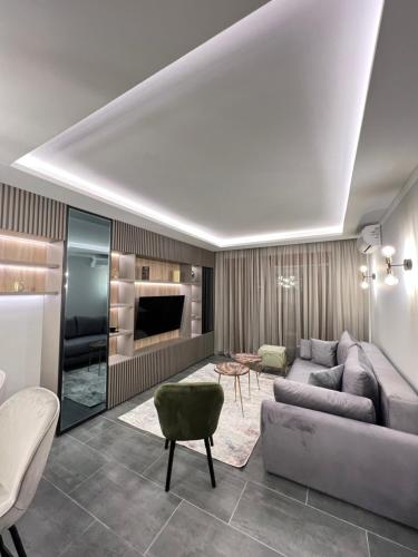 a living room with a couch and a table at Varja 3 Apartment in Pržno