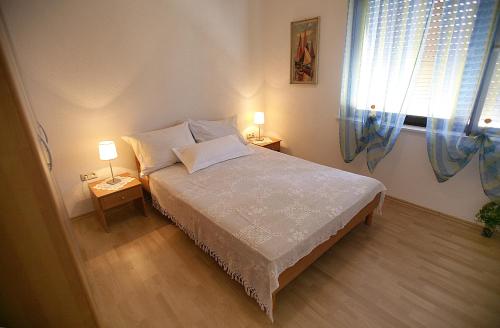 Posteľ alebo postele v izbe v ubytovaní House Peri