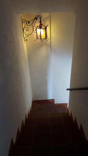 a stairway with a light hanging from a wall at Casa Barbara in Amalfi