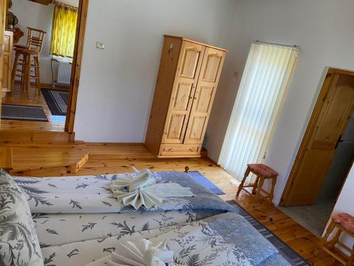 a bedroom with a bed and a wooden floor at вила Здравец in Yagodina