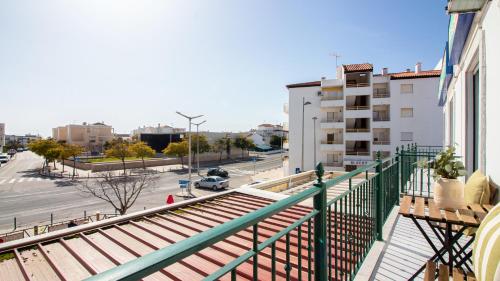 a view of a street from a balcony of a building at Altura Vacations T2, Algarve in Altura