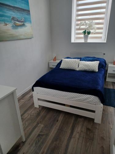Posteľ alebo postele v izbe v ubytovaní Mieszkanie przy Molo
