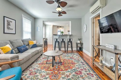a living room with a couch and a table at Mystic Refuge with Patio Less Than 1 Mi to Downtown! in Mystic
