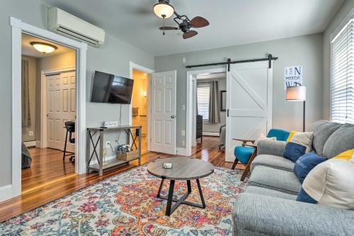 a living room with a couch and a table at Mystic Refuge with Patio Less Than 1 Mi to Downtown! in Mystic