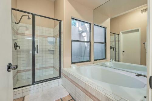 a large bathroom with a tub and a shower at Community Pool Pueblo Home Near Downtown Mesa in Mesa