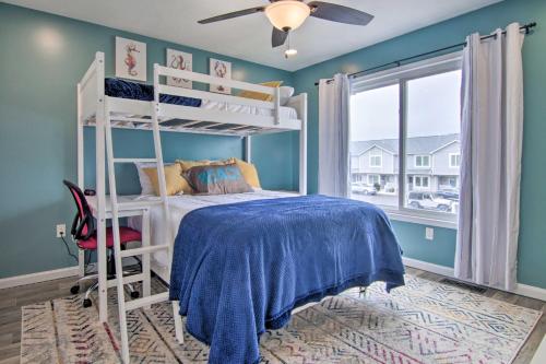 a bedroom with a white bunk bed and a window at Walk to Maryland Beach Canal-Front Escape with Dock in Ocean City