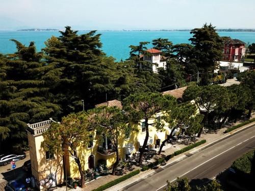 an aerial view of a street with trees and a road at South Garda Suites in Desenzano del Garda