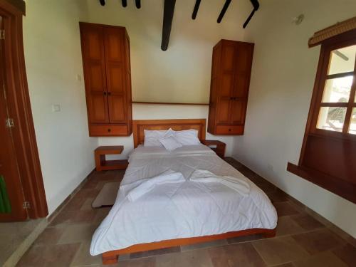 Säng eller sängar i ett rum på Finca Hotel El Paraíso