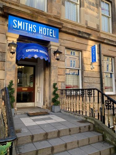a hotel with a sign on the front of a building at Smiths Hotel in Glasgow
