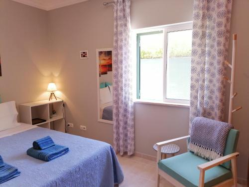 Ένα ή περισσότερα κρεβάτια σε δωμάτιο στο Azimute Guest House