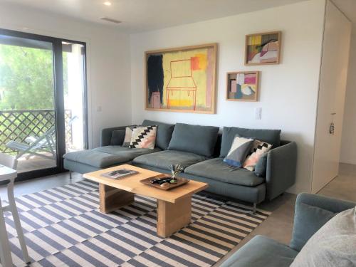 a living room with a couch and a coffee table at Faraway Falésia in Olhos de Água
