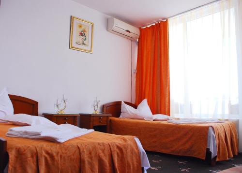 Postel nebo postele na pokoji v ubytování Hotel Scoica