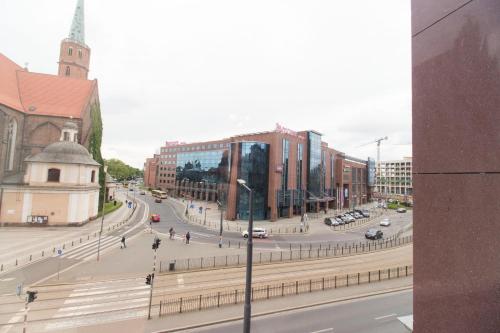 a view of a city with a street and buildings at Happy Apartments - Just In Center in Wrocław