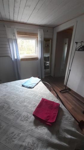 Postel nebo postele na pokoji v ubytování Kapteni suvekodu
