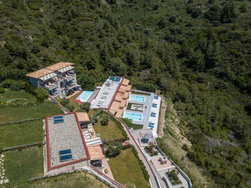an aerial view of a building on a hill at Koumaros Aparthotel in Agia Paraskevi