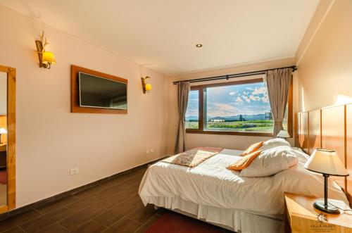 Postel nebo postele na pokoji v ubytování Villa Huapi