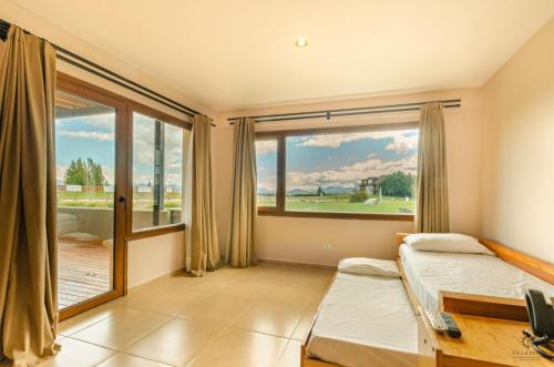 Postel nebo postele na pokoji v ubytování Villa Huapi