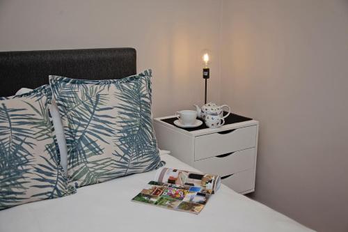 Postel nebo postele na pokoji v ubytování Aloe Aloe Cottage