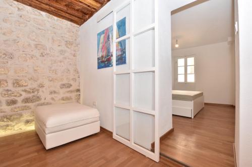a room with a white closet and a bed and a mirror at Pearl in the Heart of Old Town on Belavista Square in Herceg Novi in Herceg-Novi