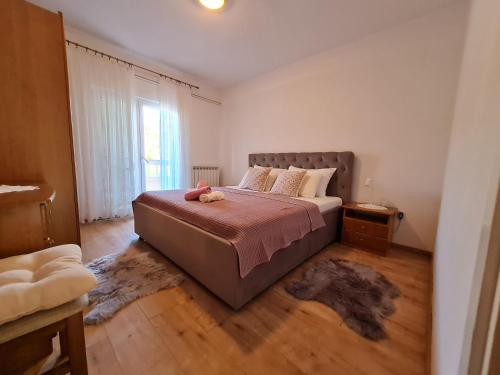 Ένα ή περισσότερα κρεβάτια σε δωμάτιο στο Apartments Nada