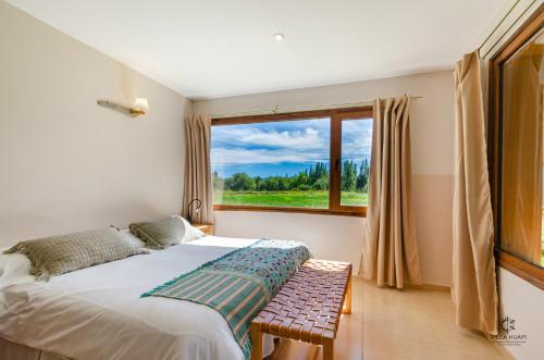 Postel nebo postele na pokoji v ubytování Villa Huapi
