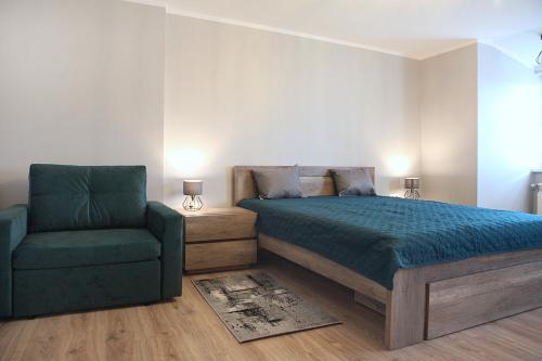 Ένα ή περισσότερα κρεβάτια σε δωμάτιο στο Apartamenty NA PODDASZU
