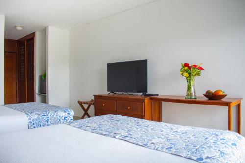 Una cama o camas en una habitación de Blu Hotel by Tamaca