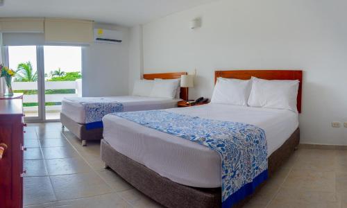 Una cama o camas en una habitación de Blu Hotel by Tamaca