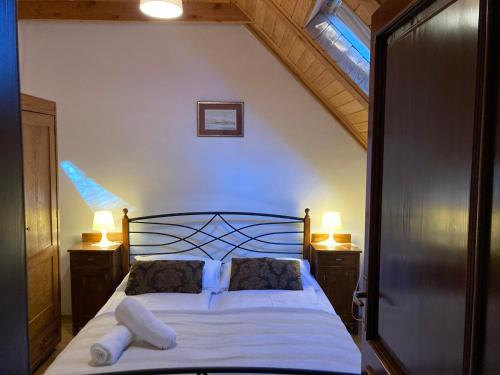 Posteľ alebo postele v izbe v ubytovaní Apartmani Belvedere