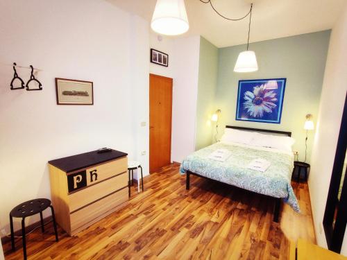 A bed or beds in a room at PH Milano