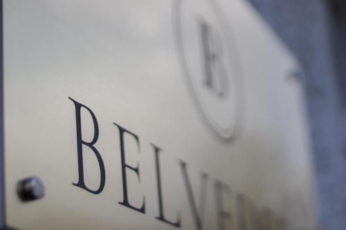 a white clock with the word berlin on it at Wrzos & Belvedere in Kudowa-Zdrój