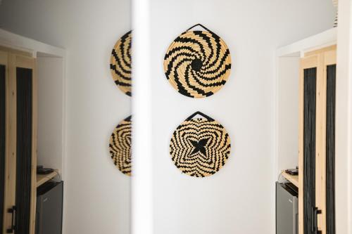 a room with several wreaths on the wall at Anatoli Hotel in Naxos Chora