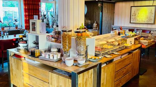 a buffet in a restaurant with a lot of food at Georgenberg in Spremberg