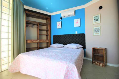 Giường trong phòng chung tại Casa Beira Mar