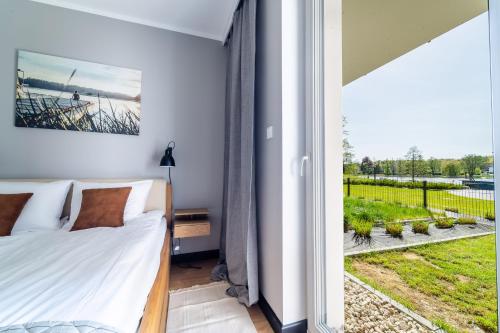 Zdjęcie z galerii obiektu Marina Blue - super widok z własnego ogródka na jezioro, parking, Netflix i Max w Iławie