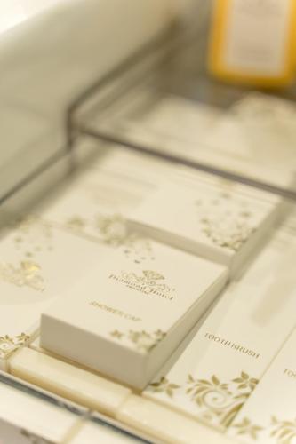 a display case filled with white wedding invitations at Hotel Diamond Prishtina in Pristina
