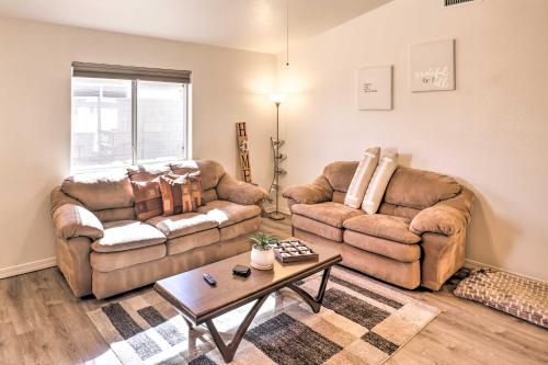a living room with two couches and a coffee table at Kid-Friendly Kingman Home Near Parks and Dining in Kingman