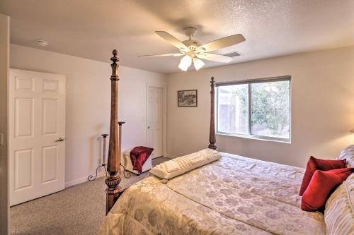 a bedroom with a bed with a ceiling fan at Kid-Friendly Kingman Home Near Parks and Dining in Kingman