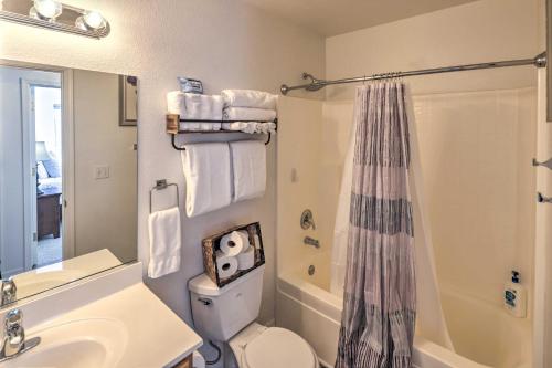 a bathroom with a toilet and a sink and a shower at Kid-Friendly Kingman Home Near Parks and Dining in Kingman