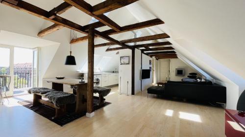 a living room with a table and a couch at ApartmentInCopenhagen Apartment 1490 in Copenhagen