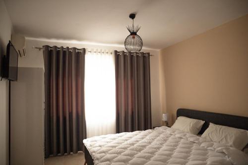 Llit o llits en una habitació de Xhelo's Rooms