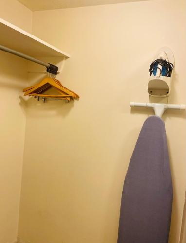 a room with a shelf with a blue surfboard on a wall at America's Best Value Inn Sandpoint in Sandpoint
