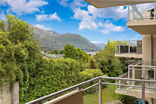 a view from the balcony of a house with mountains in the background at Belvedere Apartments in Wanaka