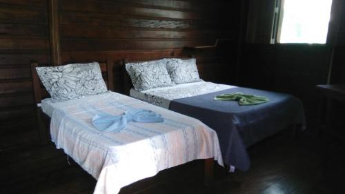 A bed or beds in a room at Amazon Gero Tours