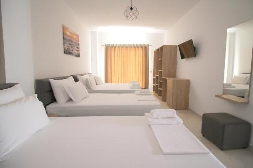 Postel nebo postele na pokoji v ubytování J&B Hotel