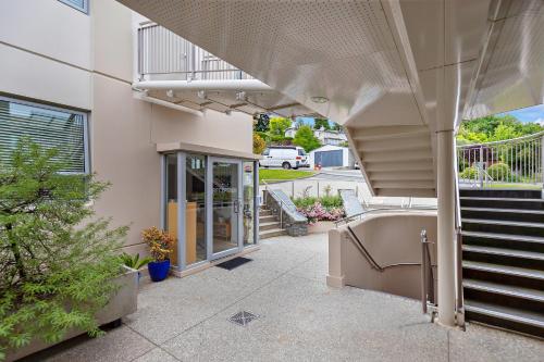 a building with a staircase and a stair case at Belvedere Apartments in Wanaka